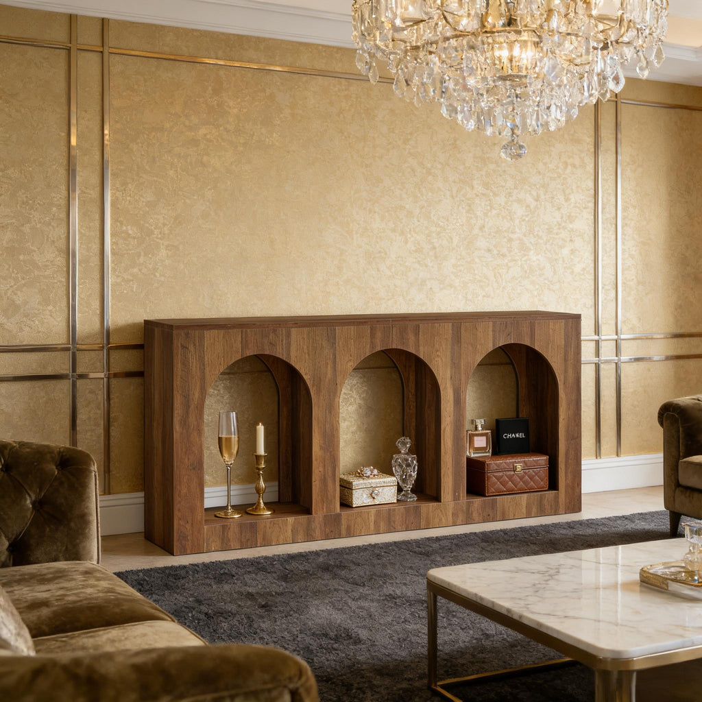 Walnut brown console table featuring three elegant arched alcoves, set against a luxurious gold-paneled wall.