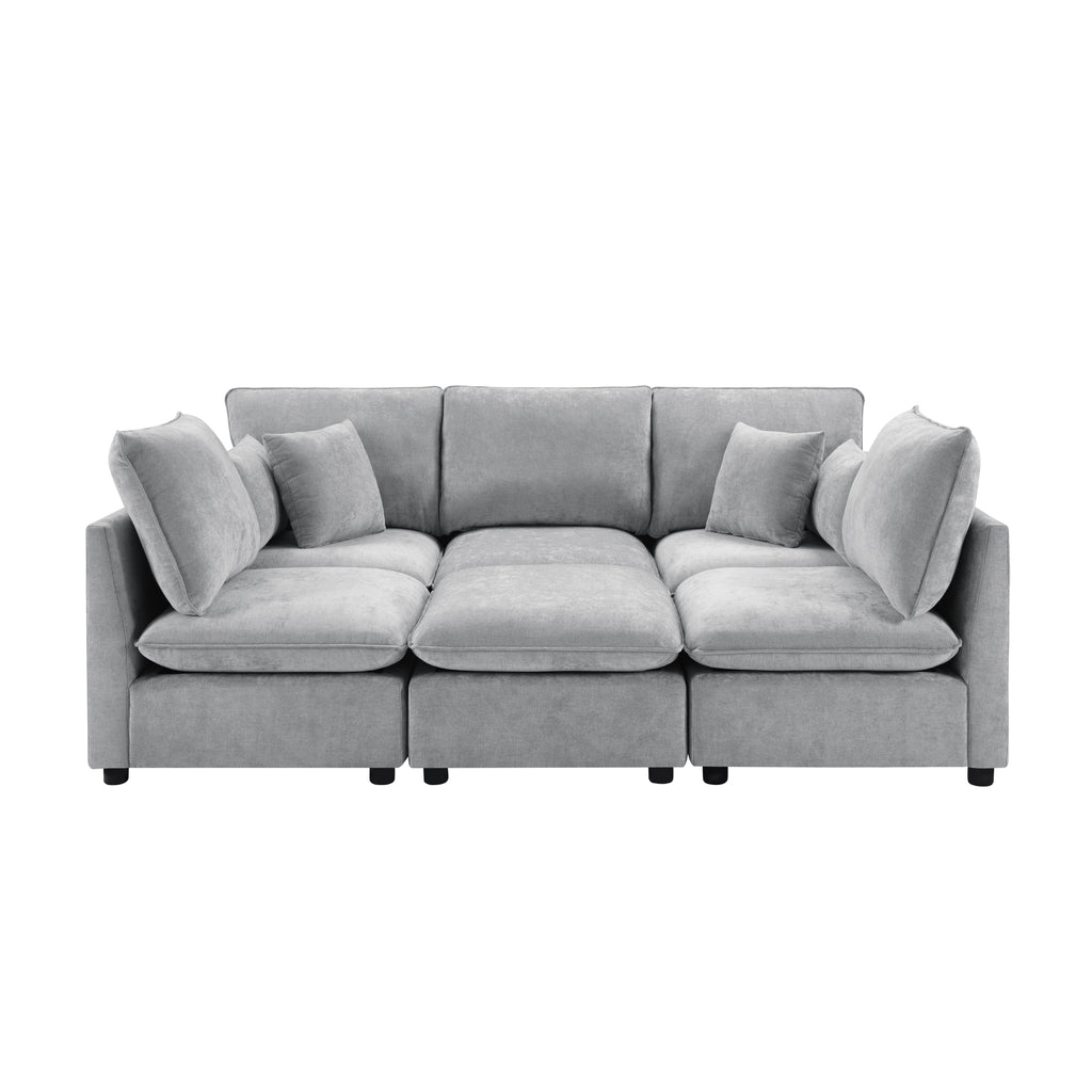 Modern grey chenille modular sectional sofa with plush cushions, accent pillows, and clean, contemporary lines.