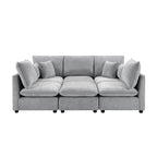 Modern grey chenille modular sectional sofa with plush cushions, accent pillows, and clean, contemporary lines.
