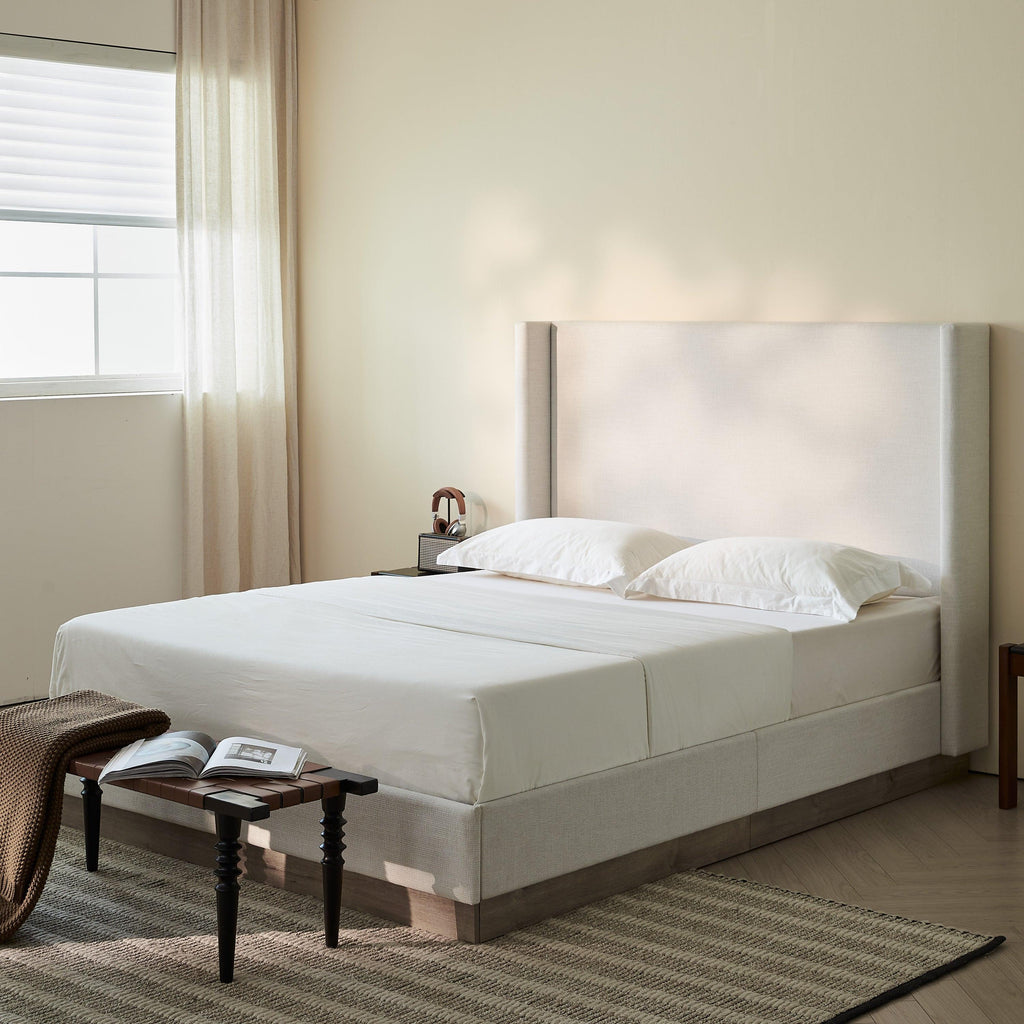 Hosford Minimalist Upholstered Wingback Bed.