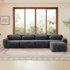 Versatile dark grey plush fabric sectional sofa with modular design and corner ottoman, perfect for spacious living room setups.