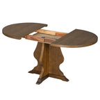 Extendable farmhouse dining table with center leaf mechanism exposed. Ideal for expanding dining space as needed.