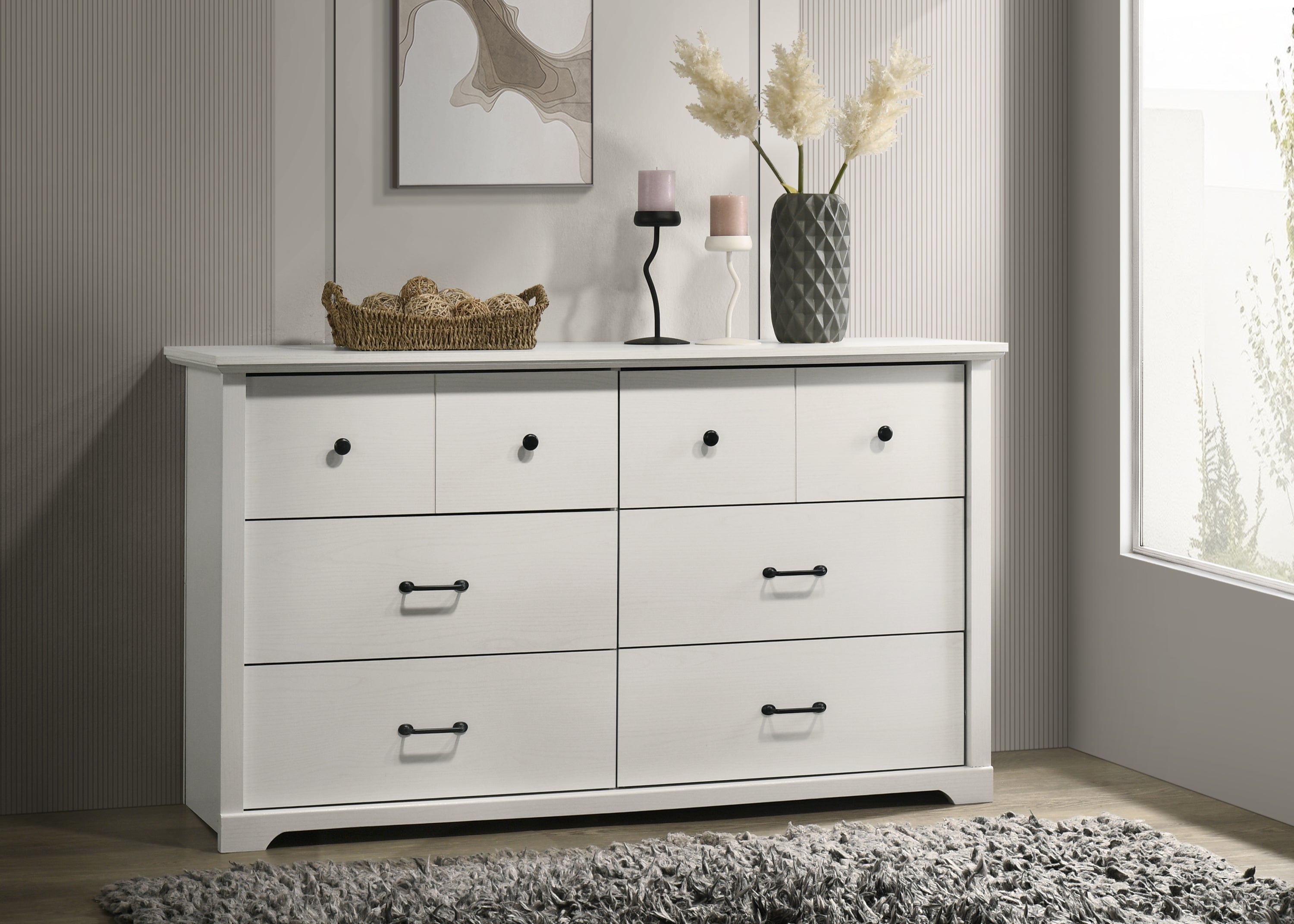 Elara White 6-Drawer Dresser - Modern Storage Solution with black handles, styled in a contemporary bedroom with decor accents.
