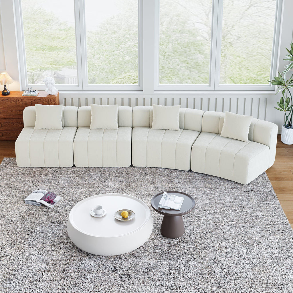Curved Sectional Sofa with 4 Pillows for Stylish Seating.