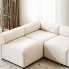 Corner section of the Evelyn U-Shaped Modular Sectional Sofa in a sunlit room, showcasing deep seats and cozy chenille fabric.