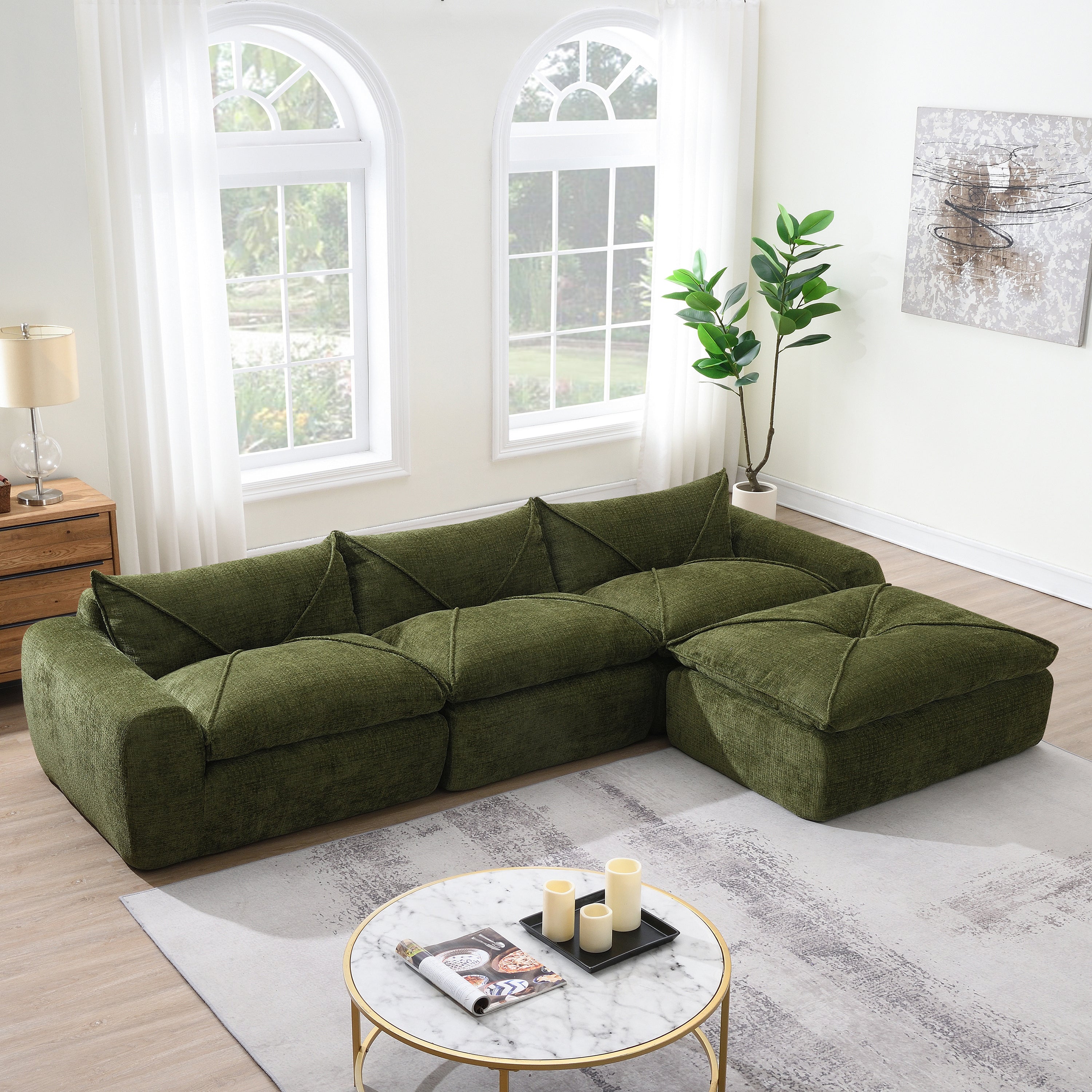 116'' compressed sofa in green chenille fabric with high density foam, no assembly required, placed in a bright modern living room.