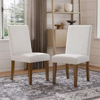 Rustic upholstered dining chairs 2pc set in a farmhouse-style room, showcasing white fabric and brown wooden legs for a warm, inviting look.
