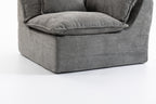 Close-up of the base of the Cloud Couch modular sectional showing durable grey velvet fabric and structured form.