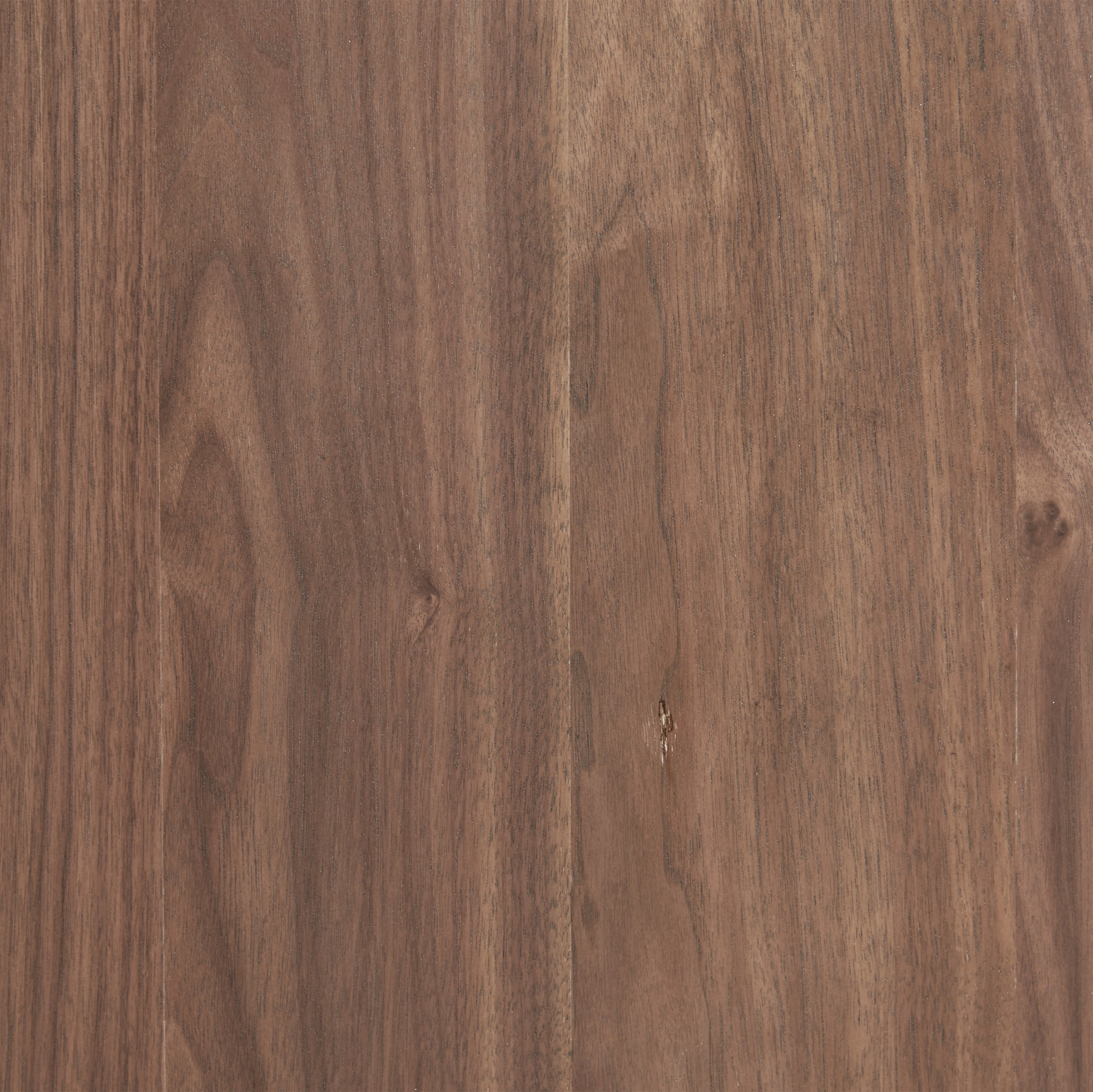 Close-up of walnut veneer texture on dresser surface. Rich wood grain enhances the dresser’s natural modern appeal.