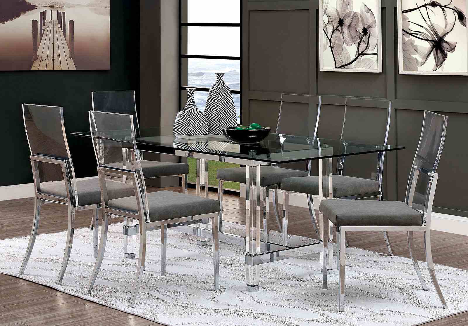 Modern dining room setup with six minimalist chrome and acrylic dining chairs around a glass table on a patterned rug.
