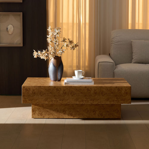 43.31-inch faux burl wood coffee table with rectangular mid-century modern design and sturdy MDF pedestal, styled in a cozy living room setting.