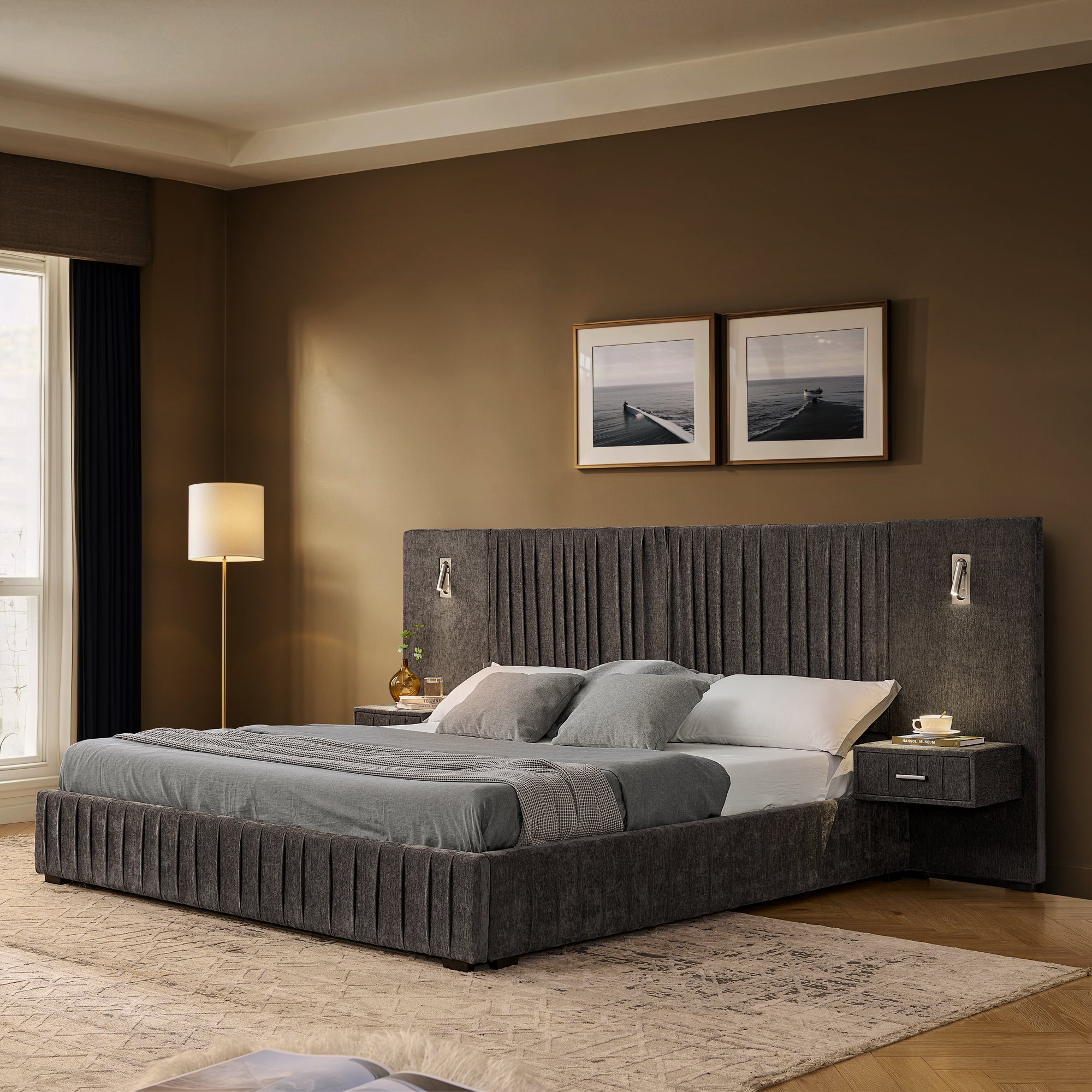Queen upholstered bed with built-in bedside tables and adjustable lamps in a modern bedroom. Solid frame and pleated headboard design.