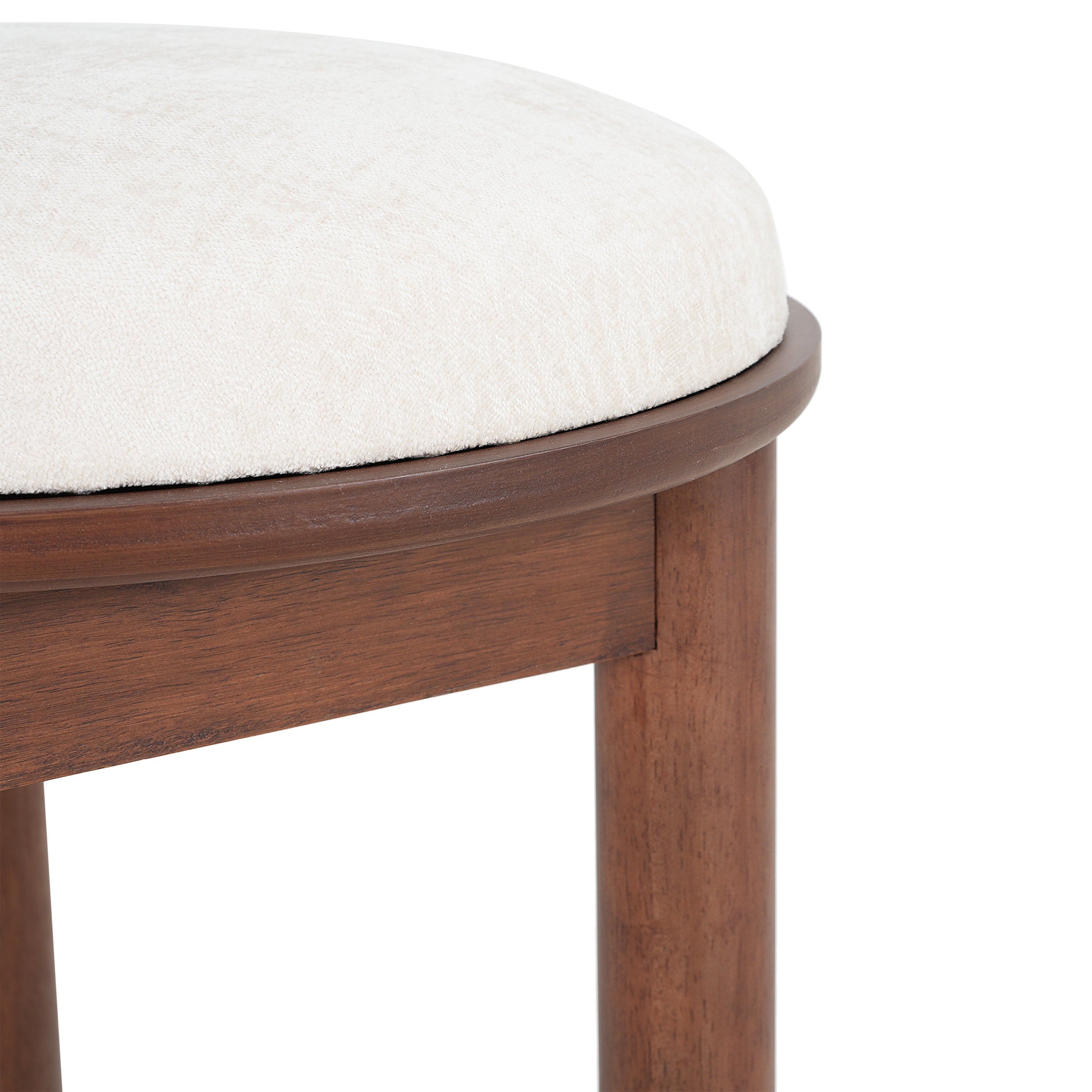 Close-up of beige dining chair seat cushion and wood frame. Highlights plush fabric and fine craftsmanship.