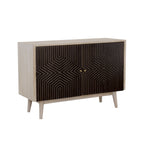 Mid-century modern accent cabinet with a white-washed wood frame and two black doors featuring a gold geometric pattern.