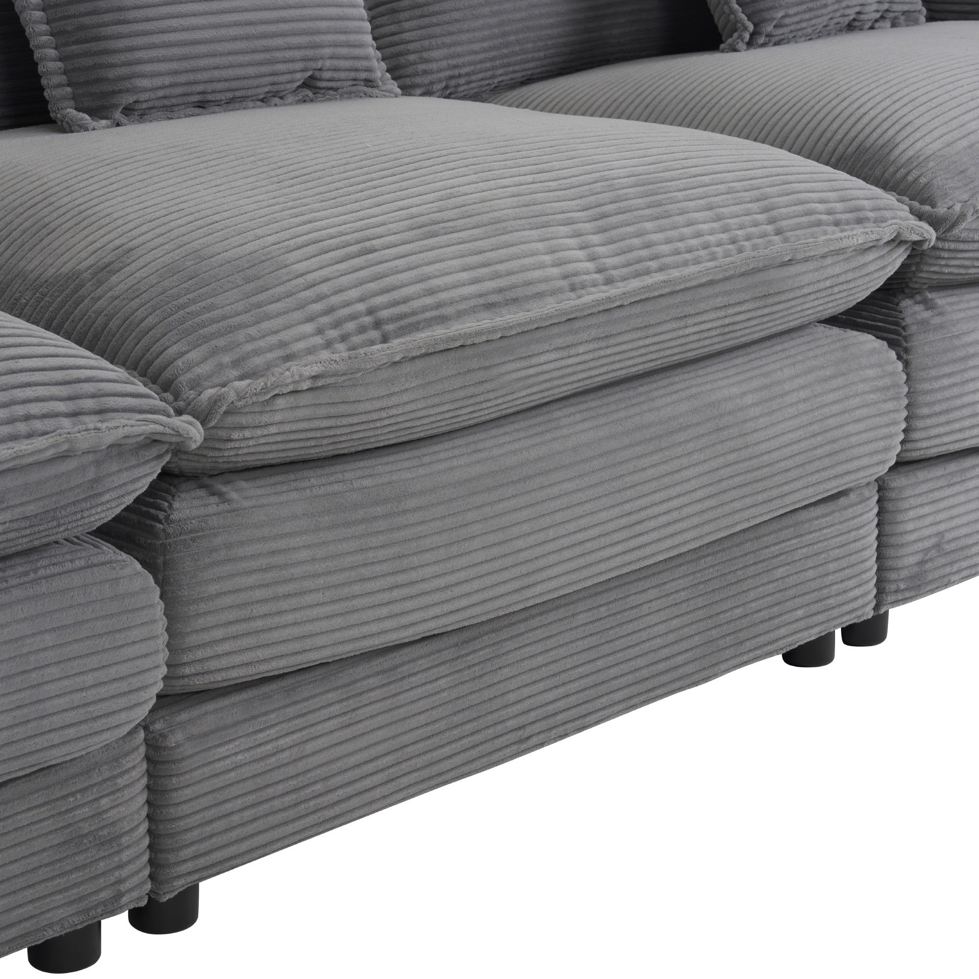 Close-up of seat cushions on modular sofa, emphasizing the thick padding and ribbed corduroy fabric for comfort and durability.