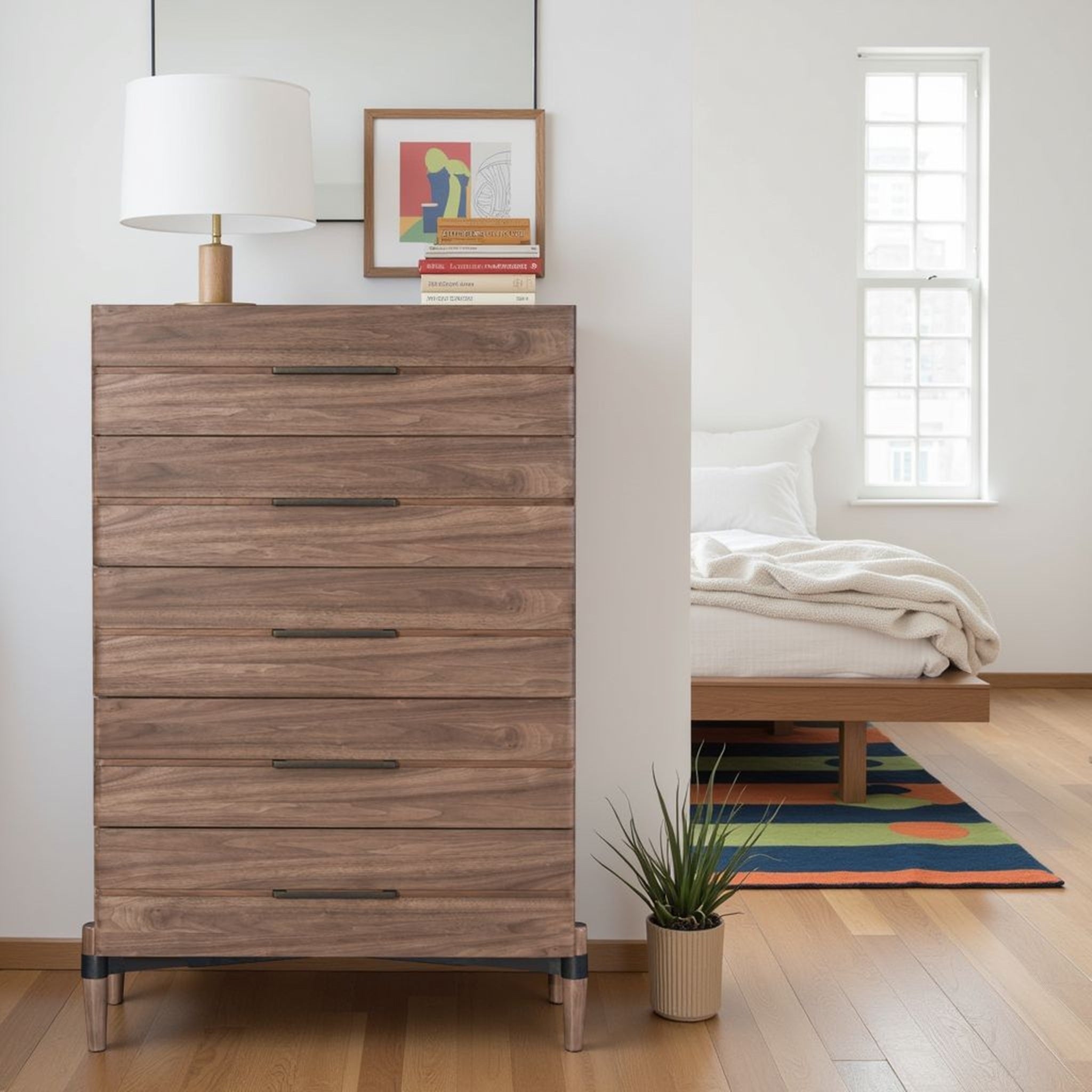 Walnut finish chest of drawers with 5 spacious drawers in minimalist bedroom. Part of Tranquility Collection, arrives fully assembled.