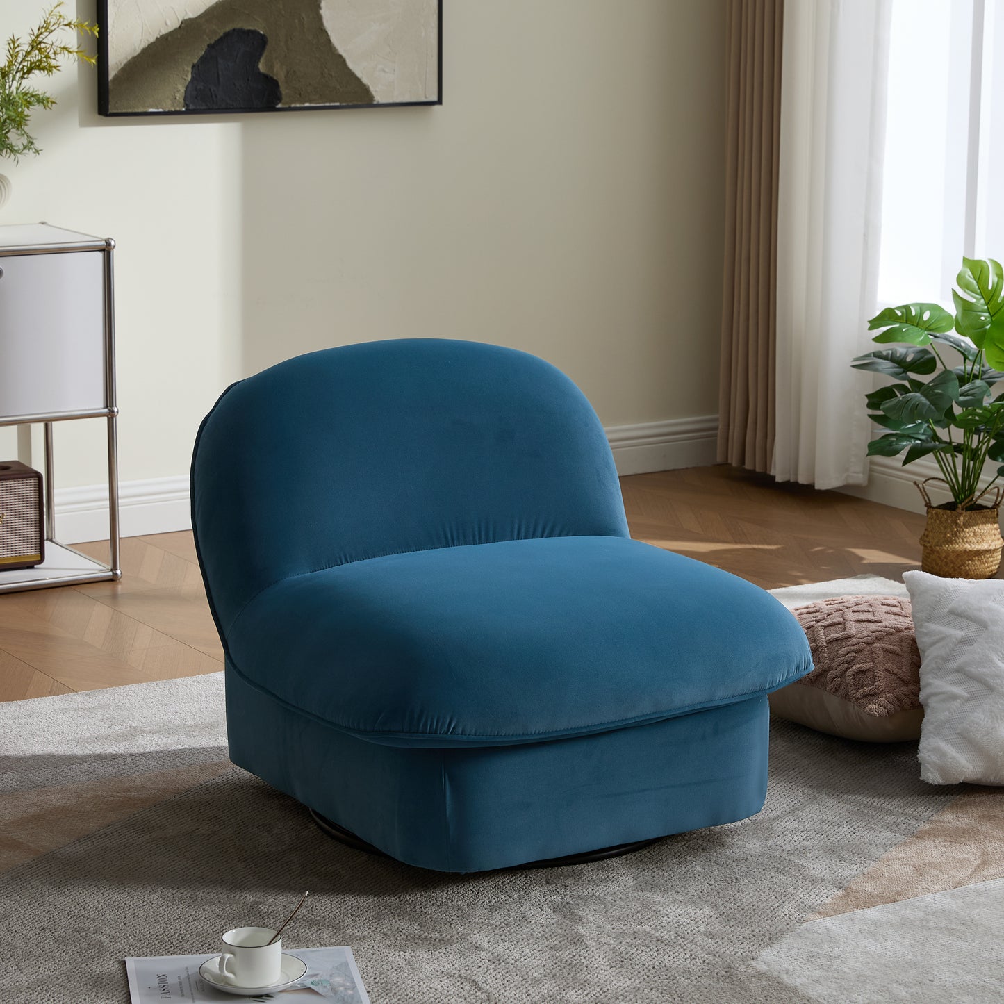 Swivel accent chair with velvet upholstery in teal, featuring a plush pumpkin-shaped design and 360-degree metal base for living room comfort.