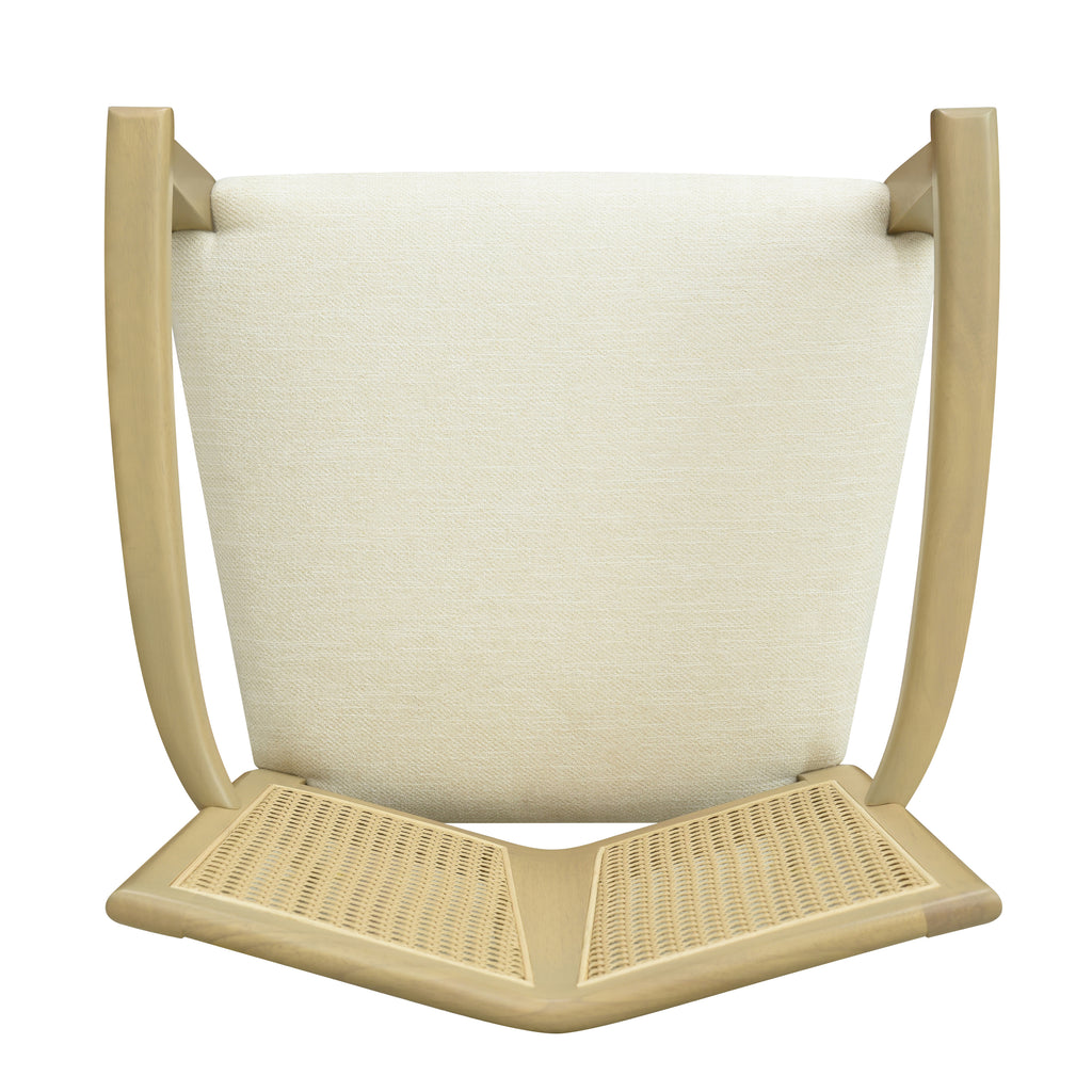 Underside view of modern dining chair showing foam seat padding and rattan backrest construction, built for durability and comfort.