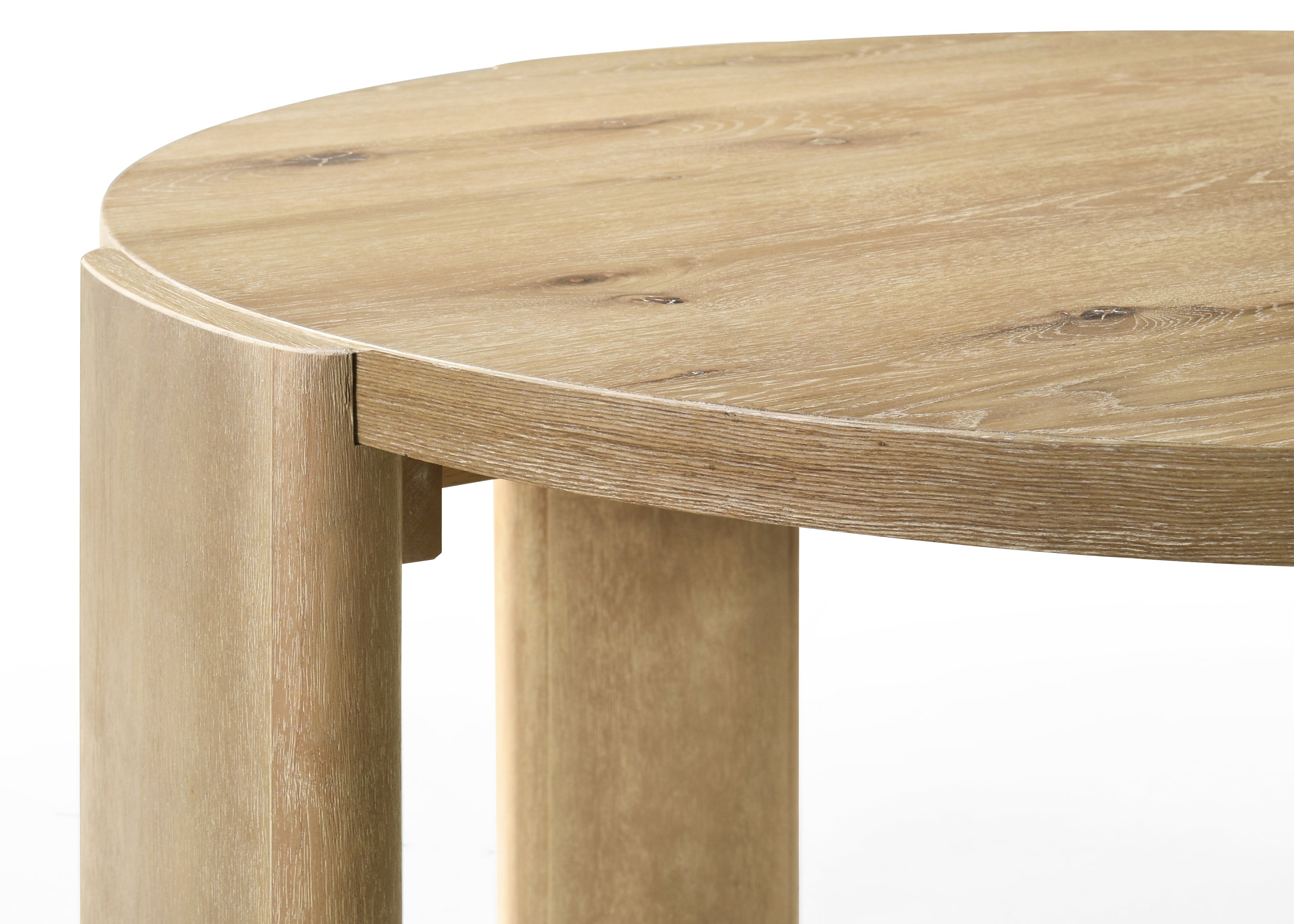Close-up of Bowen Oak Finish Table edge showing the detailed wood texture and seamless joinery of the round tabletop.