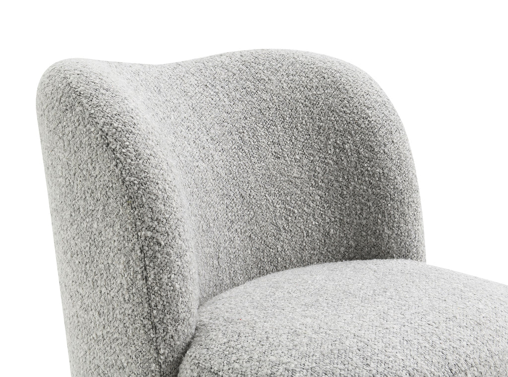 Detail of the curved backrest and soft boucle fabric on the gray accent chair, highlighting its modern and cozy design.