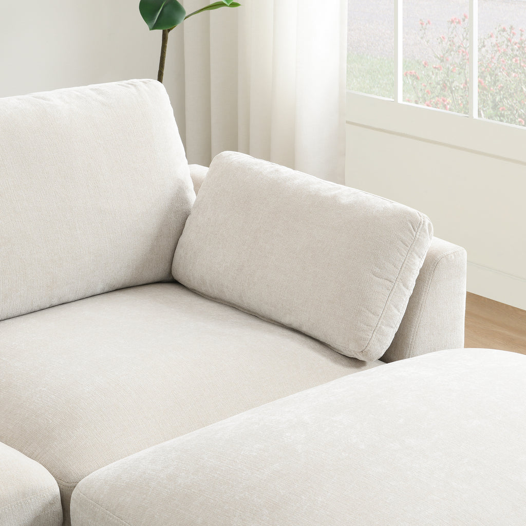 Lumbar cushion placed on the chaise section of the modular sectional sofa for added back support.