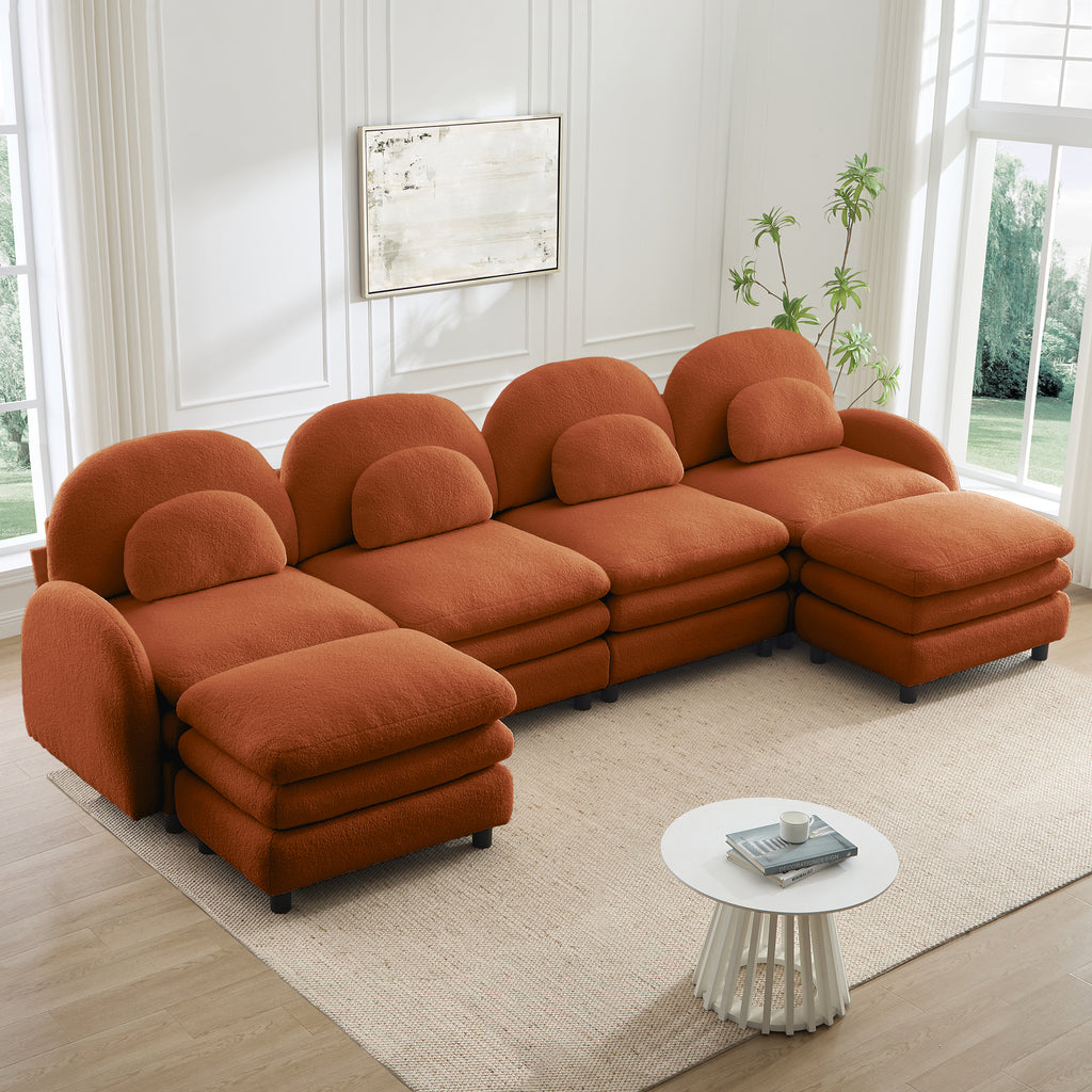 Orange 4-seater modular teddy fabric sectional sofa with curved backrests, lumbar pillows, and two movable ottomans.