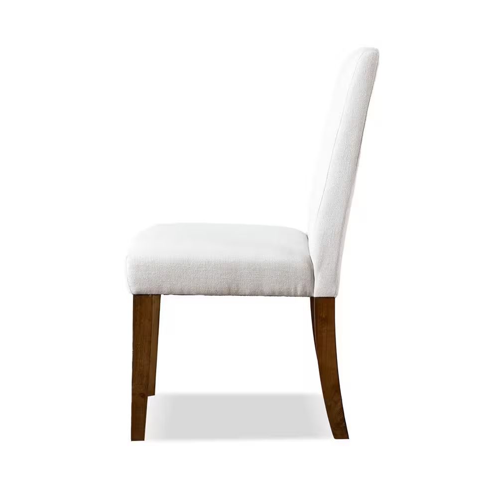 Side profile of rustic upholstered dining chair with white fabric and brown wood legs, designed for comfort and style.