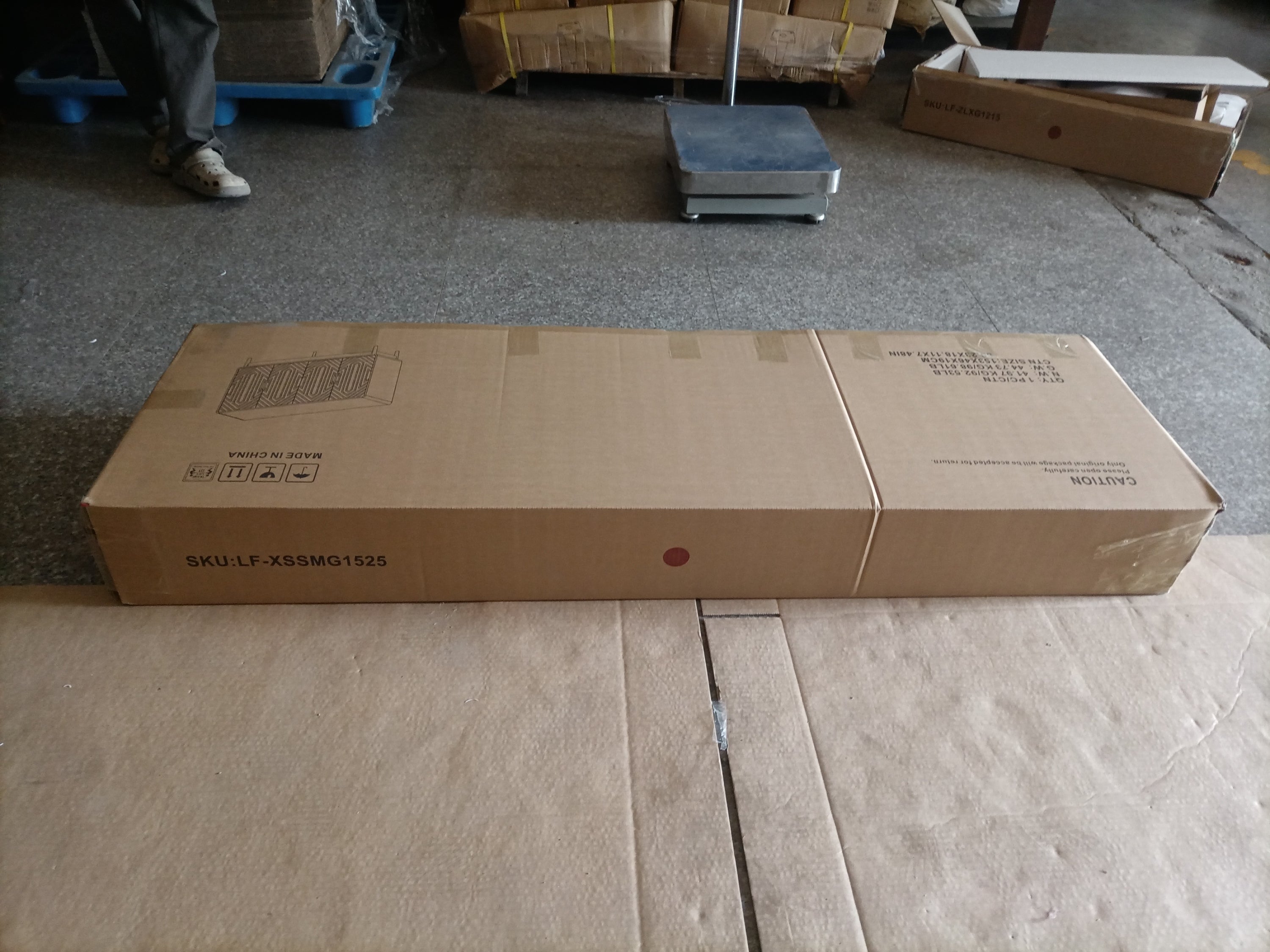 Sealed shipping box for walnut sideboard buffet cabinet, showing compact packaging for convenient transport and assembly.