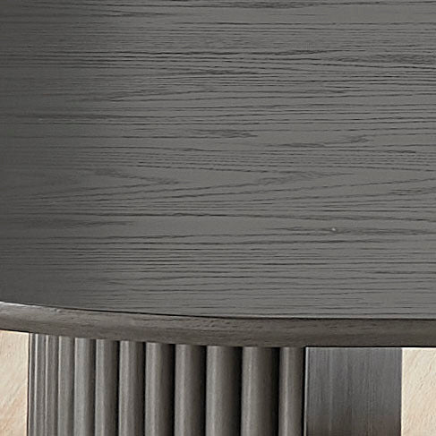 Detail view of the gray oak tabletop and pedestal joint, highlighting the wood grain and sturdy construction of the dining set.