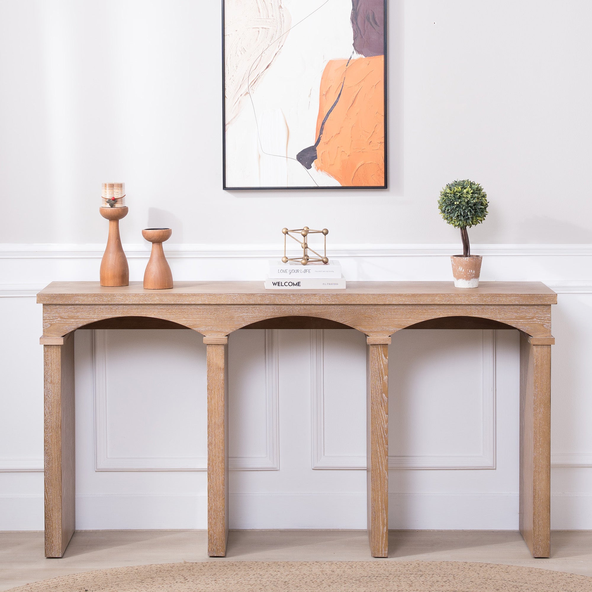 60-inch Rustic Archway Console Table styled in a foyer with decor accents, showcasing its elegant design and natural wood texture.