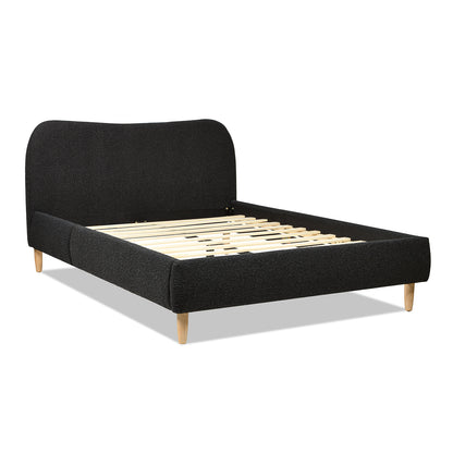 Angled view of Curved Upholstered Platform Bed Queen, Ebony Black Boucle with exposed slats and soft boucle fabric frame.