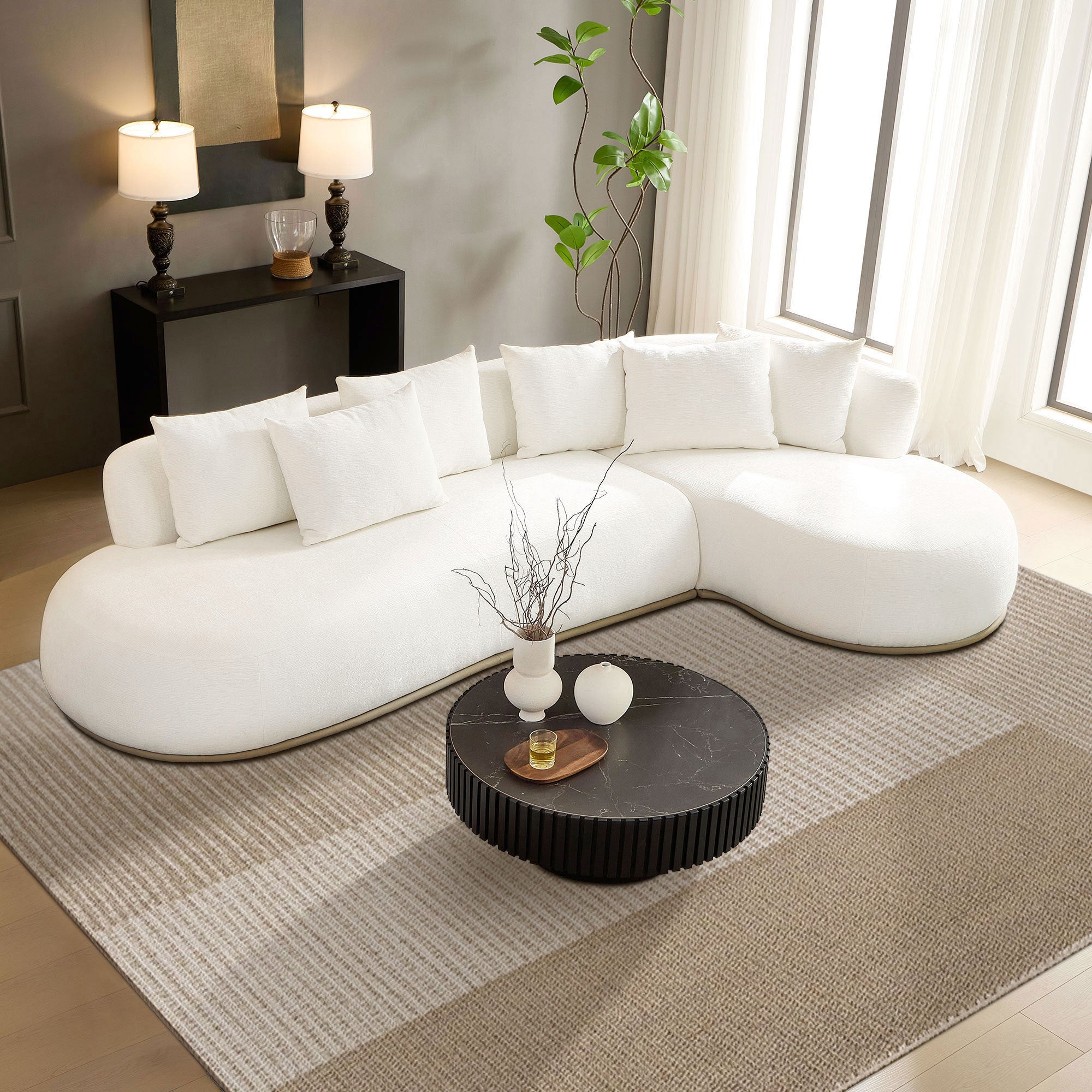 L-Shape Sectional Sofa - Oversized 5-Seat Modern Couch in beige styled in a contemporary living room with a round black coffee table.