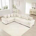 Oversized cream corduroy modular sectional sofa with deep seats, extra-wide armrests, and twelve matching throw pillows.