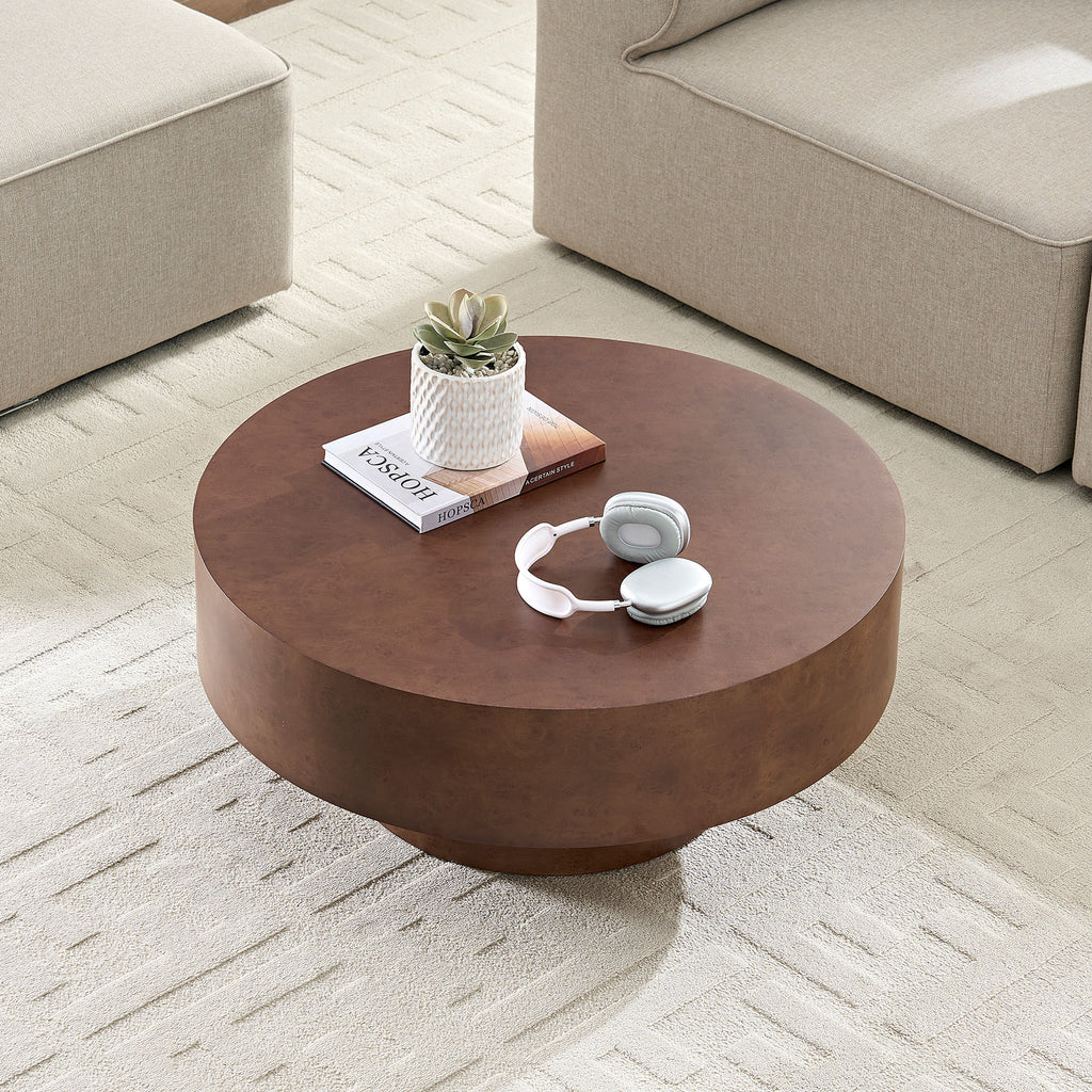 Faux Burl Coffee Table in a bright room with beige furniture, emphasizing its compact round shape and warm walnut tone.