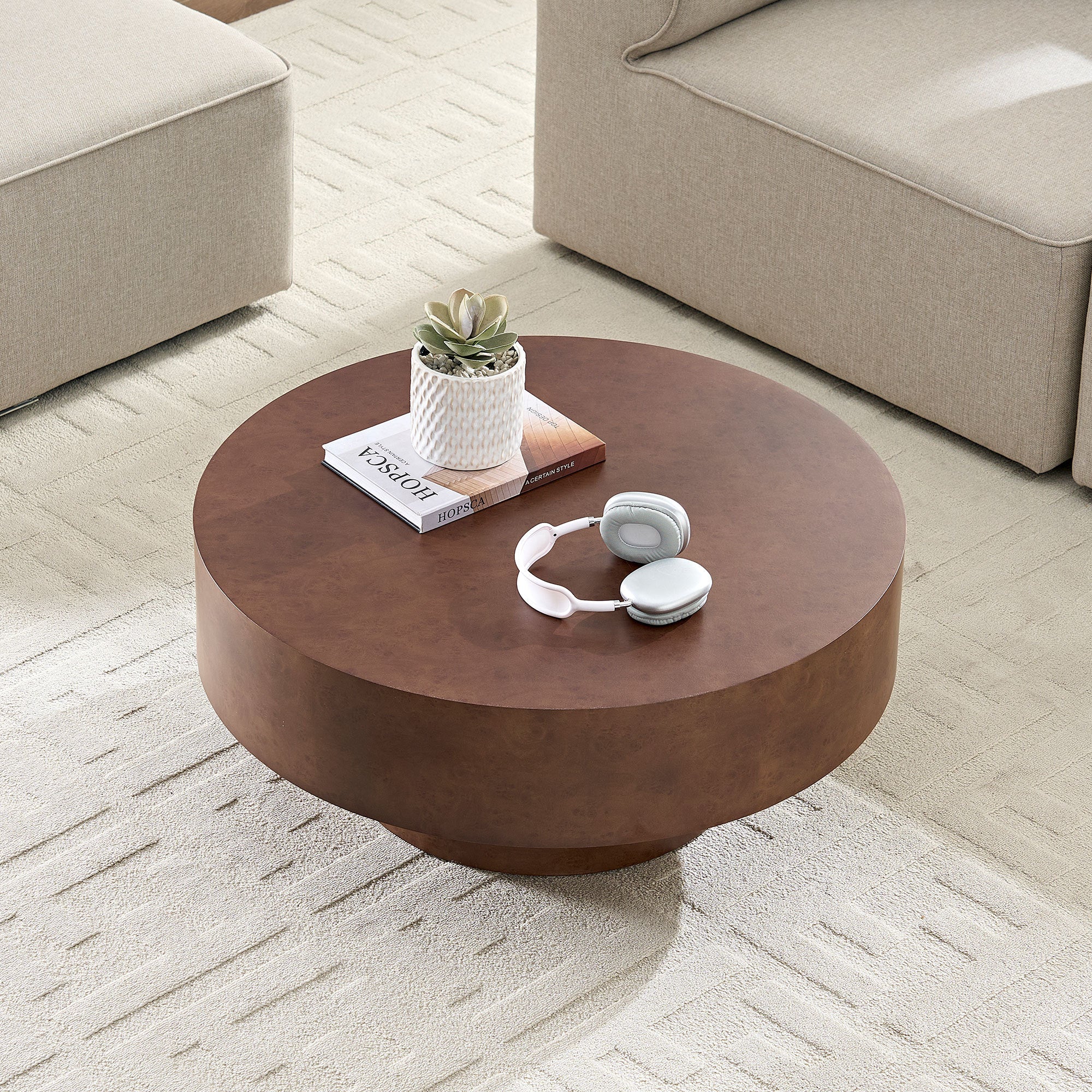 Faux Burl Coffee Table in a bright room with beige furniture, emphasizing its compact round shape and warm walnut tone.