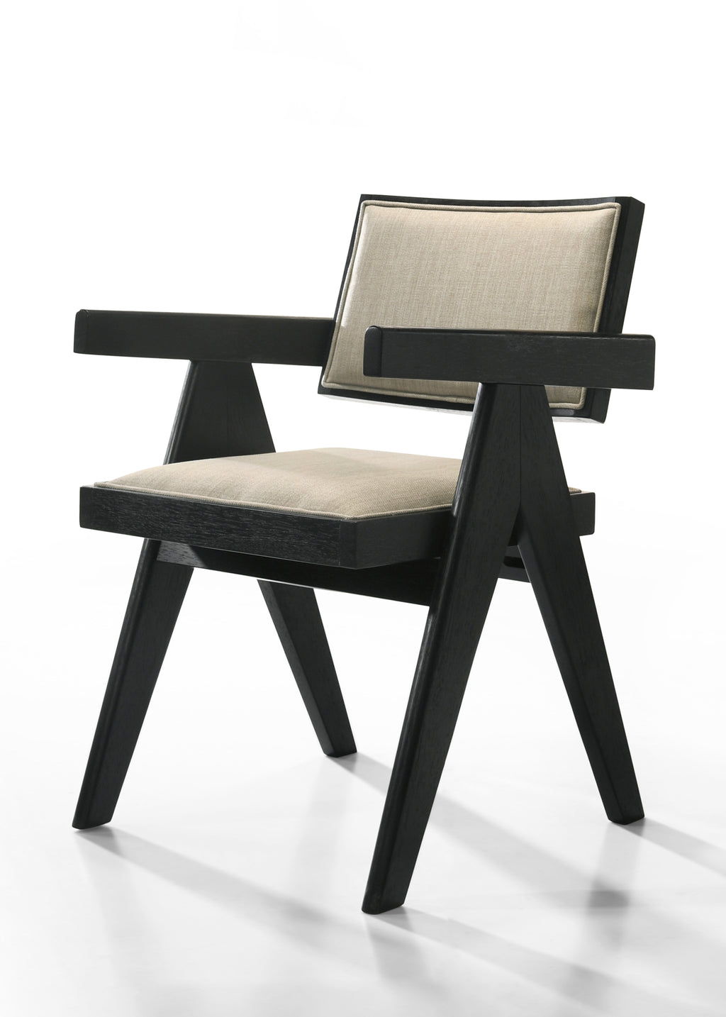 Angled view of Jasper dining chair showing V-shaped ebony black legs and cushioned beige fabric seat. Modern and sturdy design.