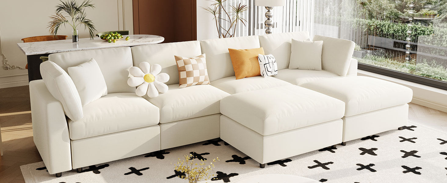 Angled view of U_STYLE U-shaped sectional sofa with 2 ottomans, placed in a bright room with large windows and modern decor.