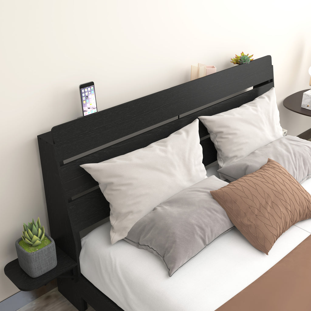 Close-up of Queen Floating Bed Frame headboard with phone slot and side shelf. Modern black wood finish with soft pillows and cushions.