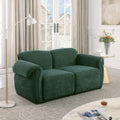 Forest green chenille modular sectional sofa with rounded arms and a sturdy iron frame, set in a modern living room.