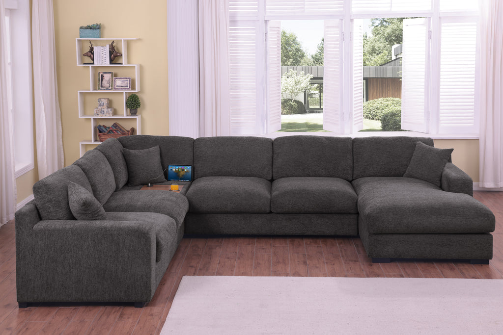 Gray chenille sofa sectional with chaise lounge and tech-friendly features like cupholders and USB charging ports in a cozy interior.