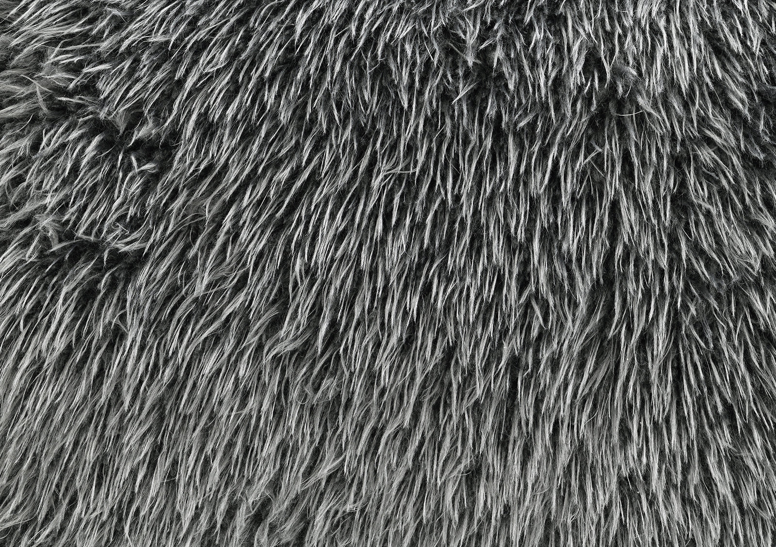 Close-up of dark gray faux fur texture on the Accent Swivel Chair. Soft and luxurious material enhances comfort and visual appeal.