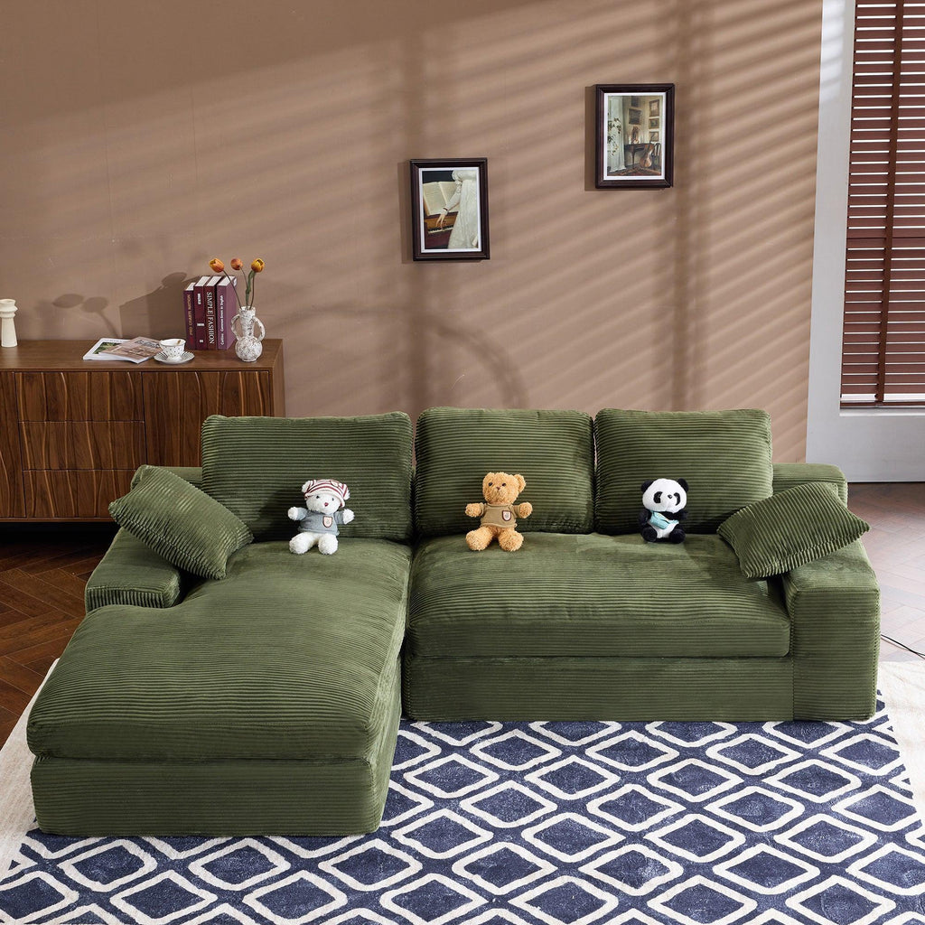 Green Corduroy Sofa with Cushions and Pillows.