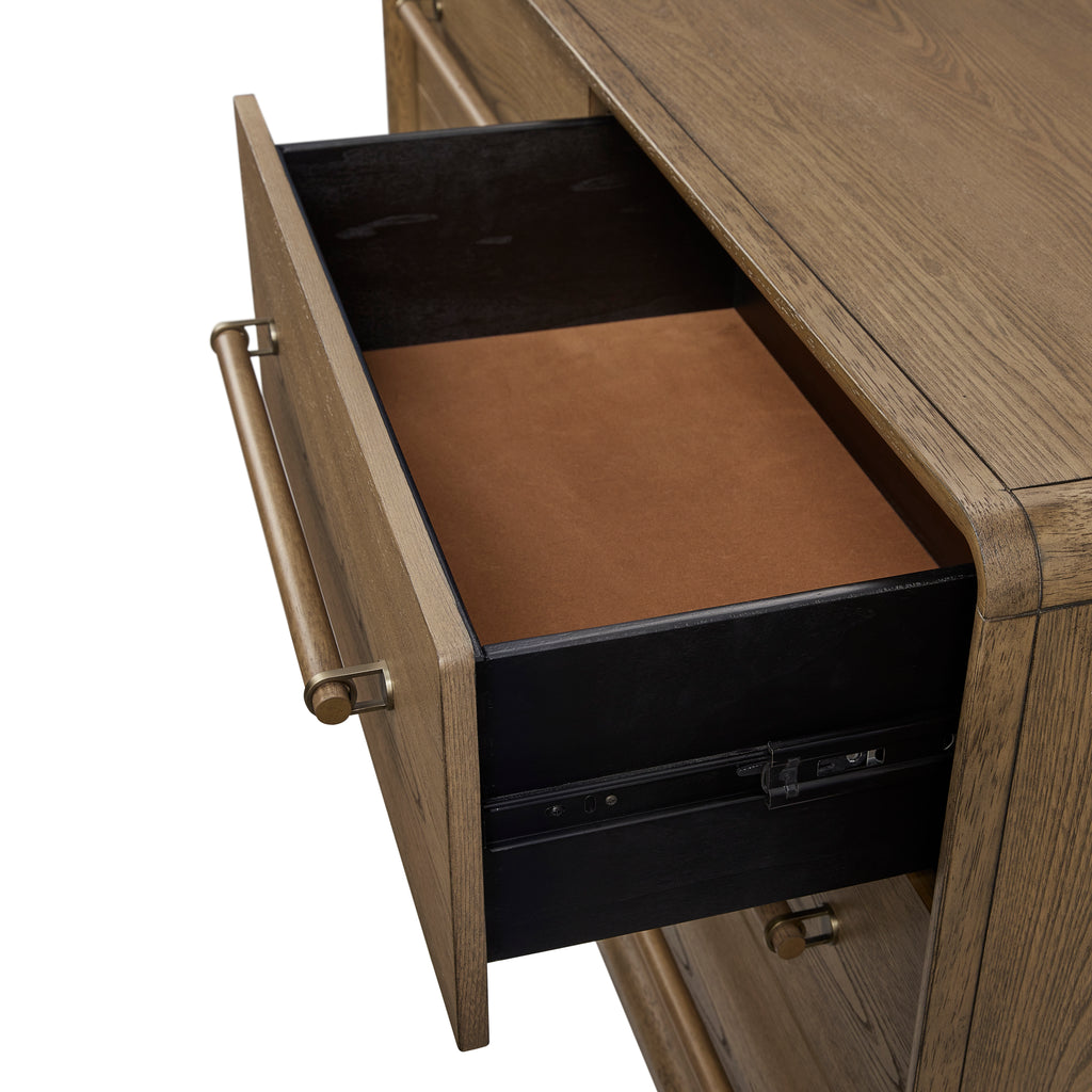 Interior view of top drawer in solid wood small dresser, lined with soft brown felt for protecting delicate items like jewelry or accessories.
