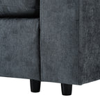 Bottom corner of modular sofa showing sturdy black legs and durable grey fabric, designed for modern living room use.