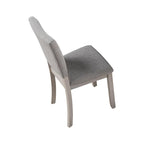 5pc dining set with gray upholstered chairs and round table.