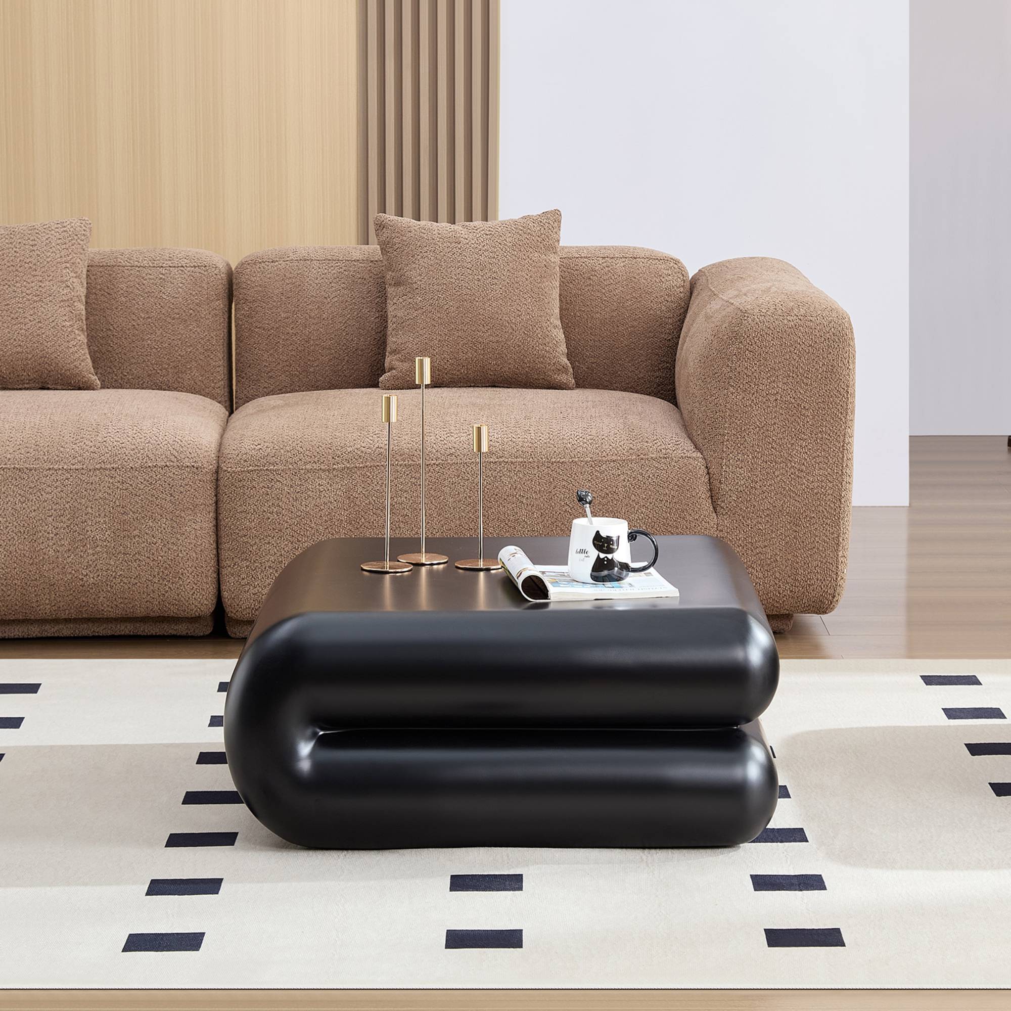 Fiberglass coffee table with modern black design placed in a living room with beige sofa and geometric rug, ideal for contemporary interiors.