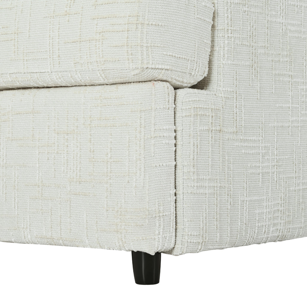 Detailed view of the sofa base and black leg of the U-shaped sectional with ottoman, featuring durable chenille fabric.