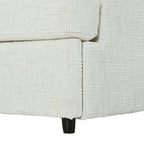 Detailed view of the sofa base and black leg of the U-shaped sectional with ottoman, featuring durable chenille fabric.