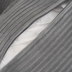 Zippered cushion cover on modular sofa revealing inner padding, designed for easy cleaning and long-lasting comfort.