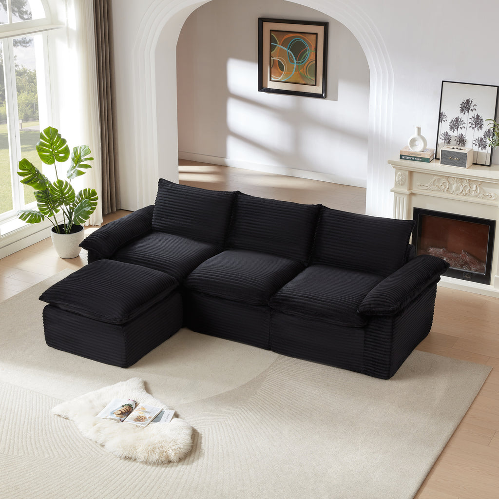 Three-seat modular corduroy sofa in black with chaise, placed in a bright modern living room. Perfect for stylish and adaptable home decor.